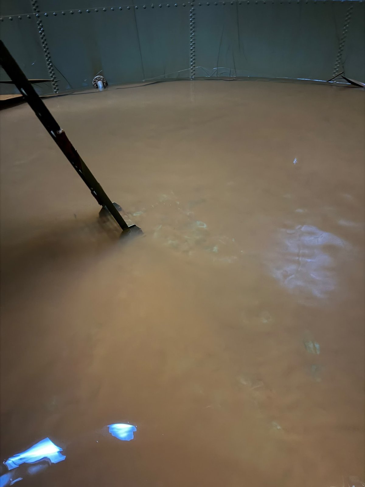 Sludge and debris — before